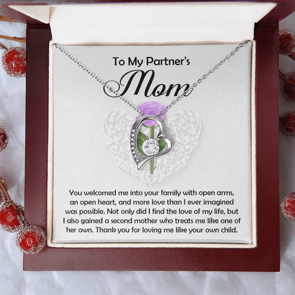 The Partner's Mom-A Second Mother - Forever Love Necklace, with a sparkling cubic zirconia heart pendant in an open red jewelry box, includes a heartfelt message inside: "To My Partner's Mom," expressing gratitude for love and acceptance.
