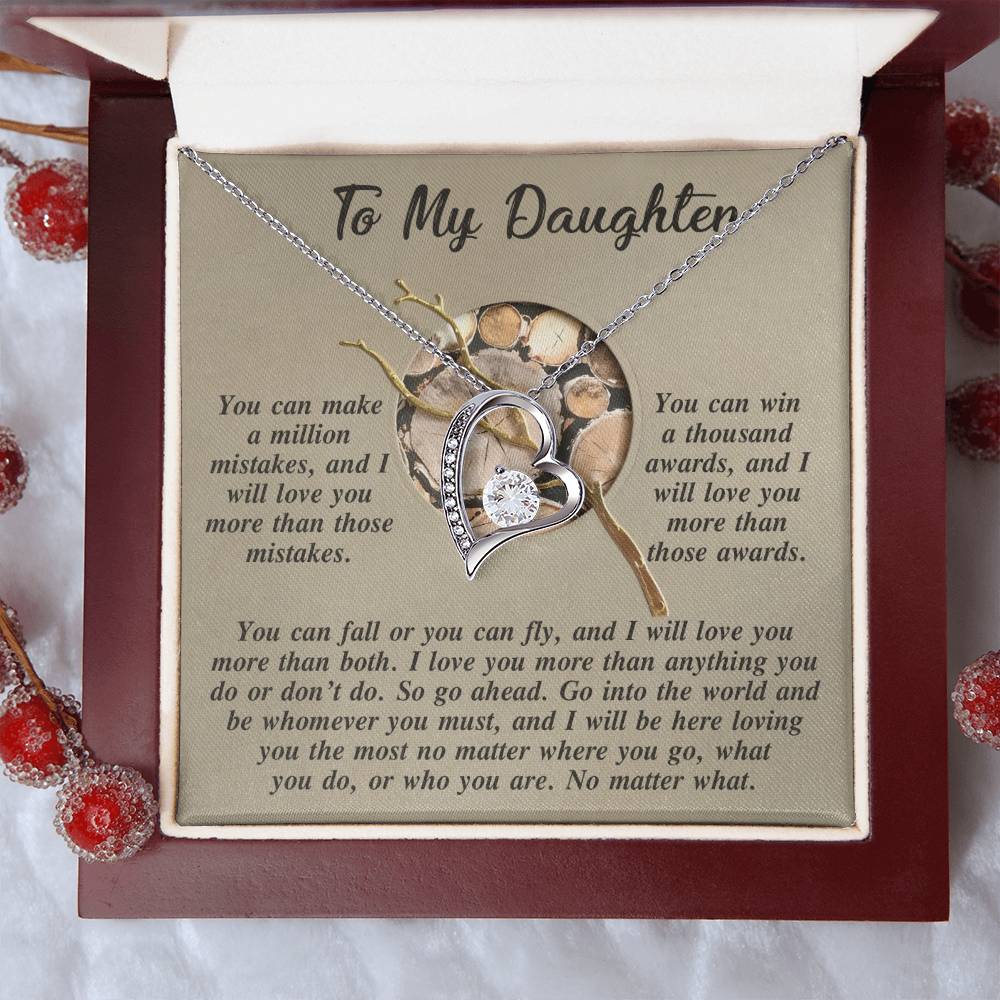 The Daughter-A Thousand Awards - Forever Love Necklace features a heart-shaped pendant with a lustrous gold finish and is presented in a box decorated with red berries. Inside, a heartfelt message to your daughter conveys unwavering love and support. The shimmering CZ crystal enhances this cherished gift with an exquisite touch.