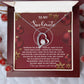 The Soulmate-By My Side 2 - Forever Love Necklace comes nestled in a gift box with a heartfelt message for your soulmate, set against a holiday-themed background.