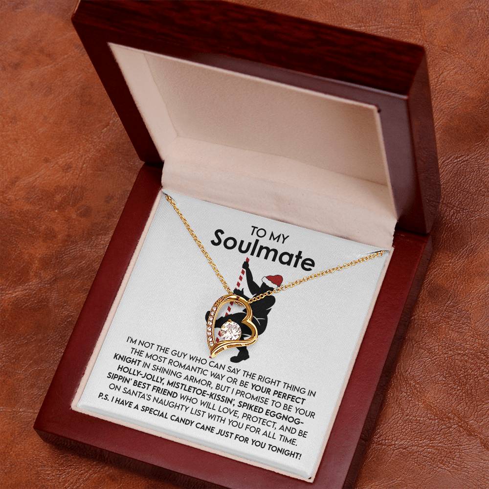 A gold finish necklace featuring an interlocking heart pendant is elegantly displayed in an open wooden box, with the inscription "To My Soulmate" and a heartfelt message inside, capturing the essence of the Soulmate-For All Time - Forever Love Necklace.