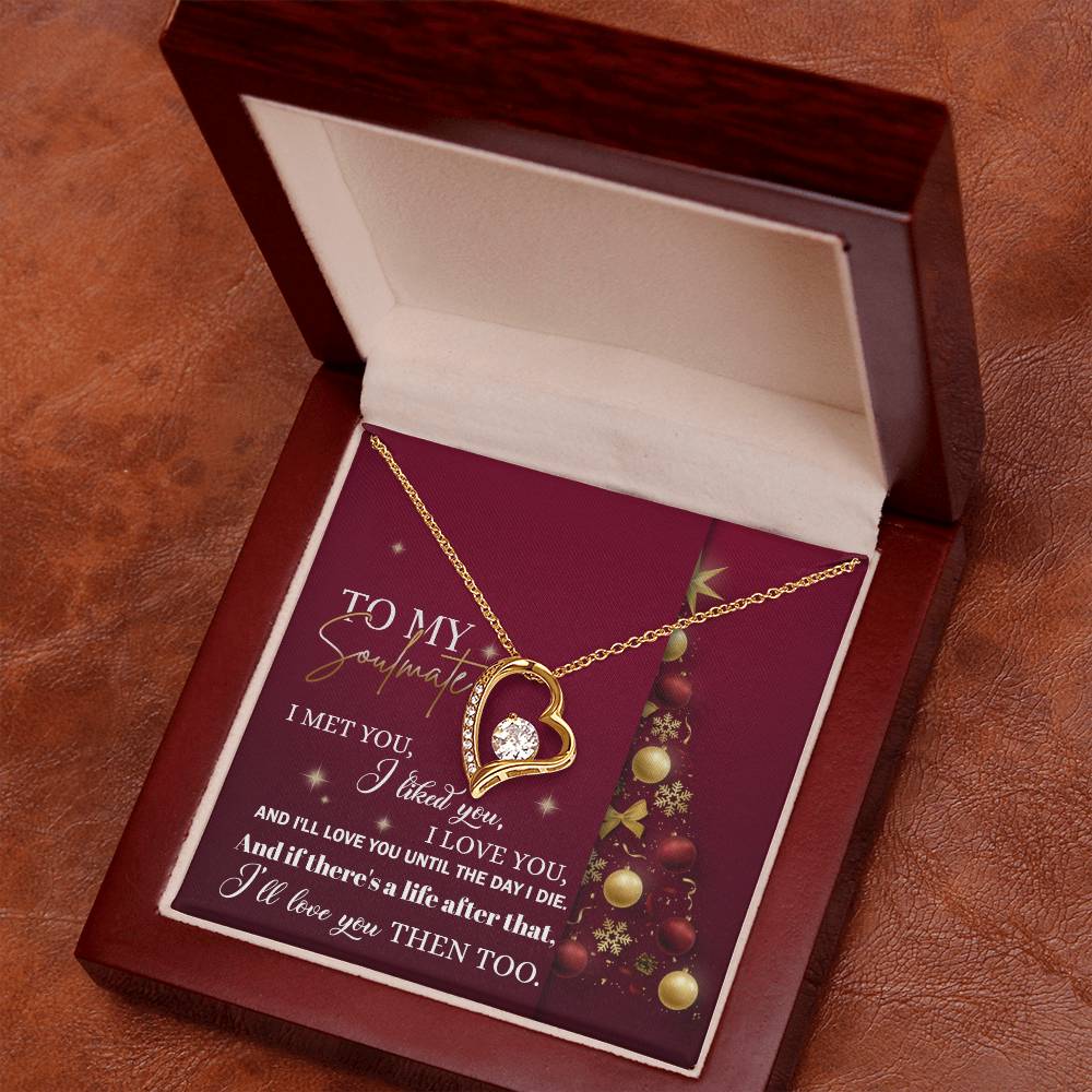 The soulmate "Love You Then" Forever Love Necklace, featuring a gold heart-shaped design with a cubic zirconia stone, is elegantly packaged in a wooden gift box. A Christmas-themed card with white script adds the perfect touch for celebrating your timeless connection.