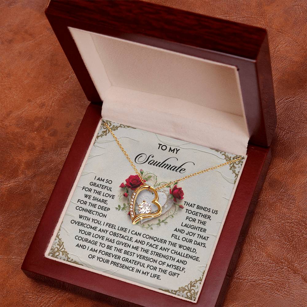 The open wooden jewelry box displays the Soulmate-Our Days - Forever Love Necklace, featuring a heart-shaped pendant with a rose design and CZ crystals. It sparkles with a white gold finish, accompanied by a heartfelt message of love and appreciation inside the lid.