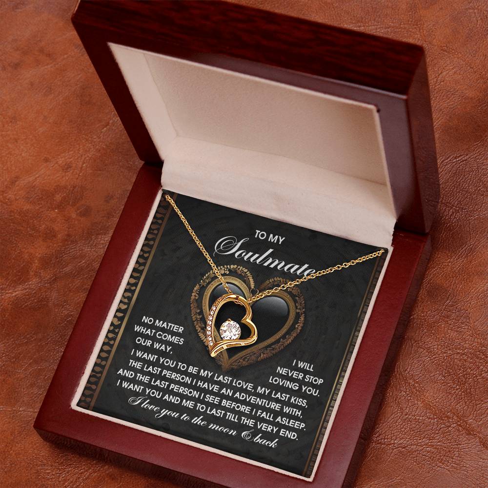 The Soulmate-The Very End - Forever Love Necklace features a heart design with a central diamond, presented in a wooden box with a heartfelt message inside. Its timeless elegance is enhanced by a 14k white gold finish.