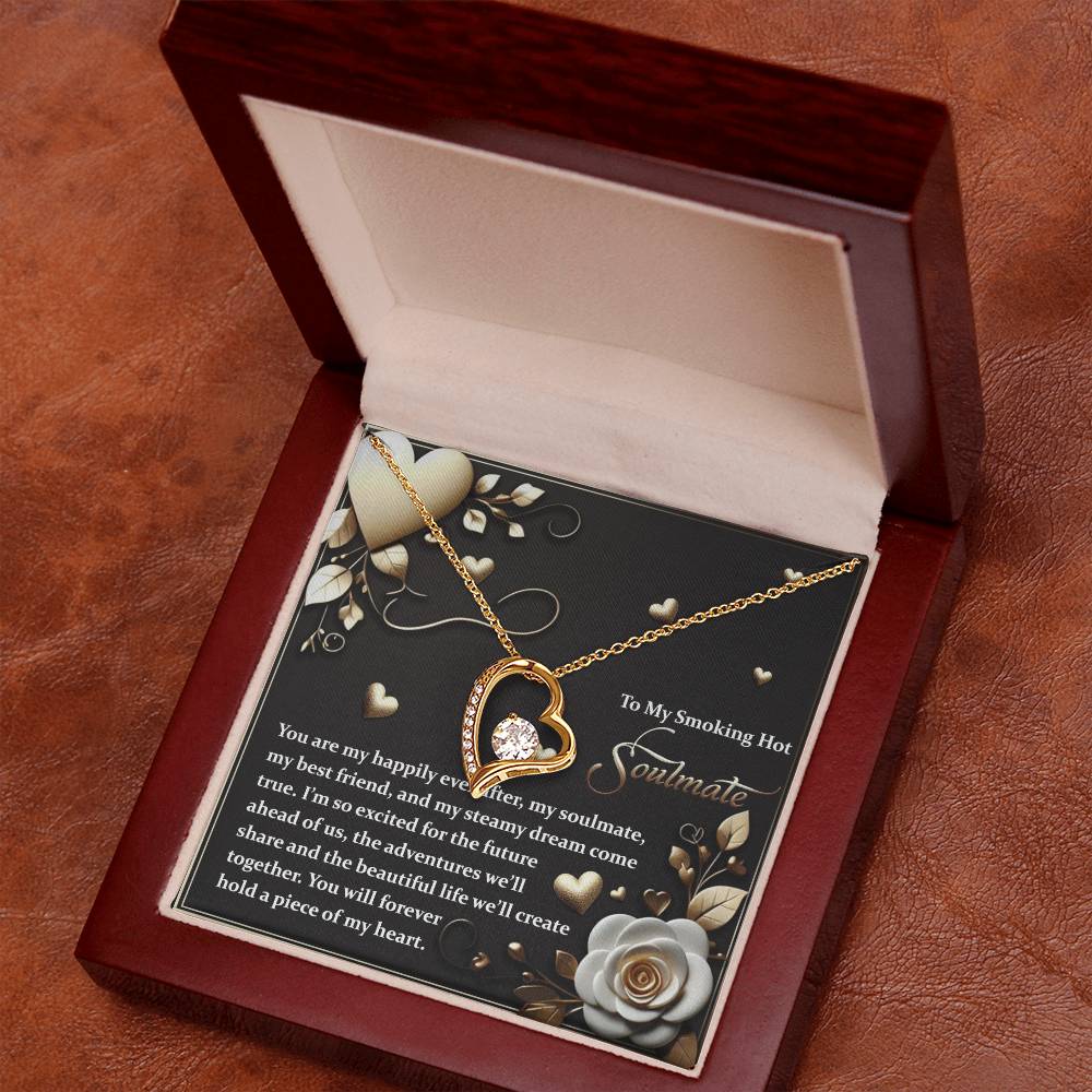 The Soulmate-The Future - Forever Love Necklace features a gold heart-shaped pendant with a cubic zirconia centerpiece, elegantly showcased in a red jewelry box, complete with a message card for your soulmate.