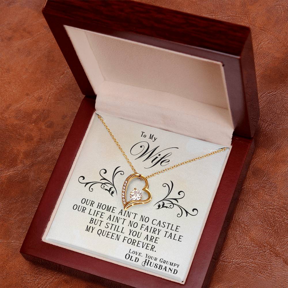 A heart-shaped To My Wife, You Are My Queen Forever Necklace from ShineOn Fulfillment, with an inscription for a wife from her husband, presented in an open jewelry box.