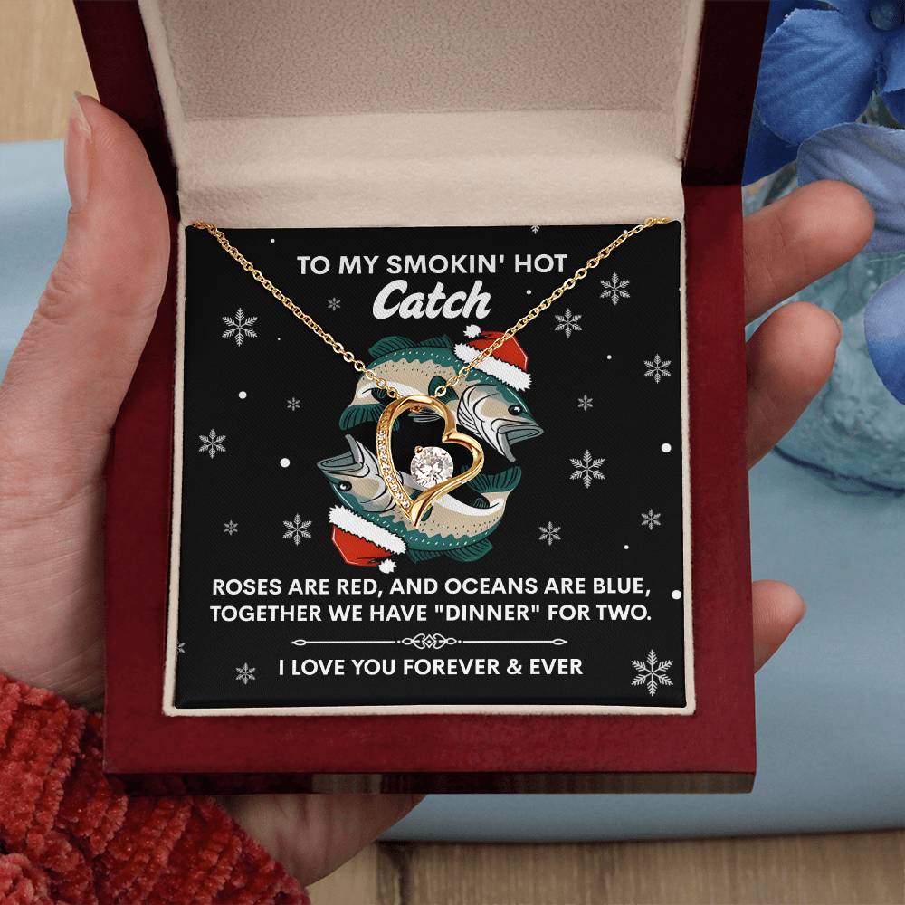 The Soulmate-Oceans Are Blue - Forever Love Necklace, in a heart shape and gold finish, is presented in a box with this message: "To my smokin' hot catch. Roses are red, and oceans are blue, together we have 'dinner' for two. I love you forever & ever.