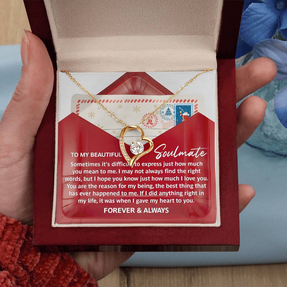 The Soulmate-Right Words - Forever Love Necklace showcases a heart-shaped gold design adorned with a brilliant CZ crystal, elegantly packaged in a refined box. It comes with a heartfelt message for your soulmate, stating "Forever & Always.