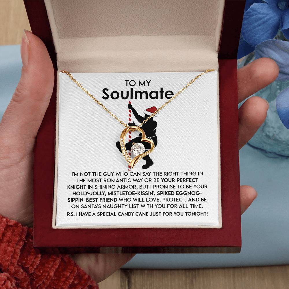 A hand holds an open box containing the Soulmate-For All Time - Forever Love Necklace with a gold finish. The inside of the box lid is inscribed with the words "To My Soulmate" and features a romantic message below.