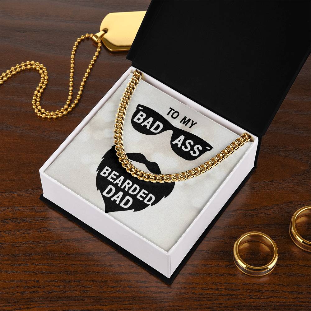 Cuban Link Chain necklace in a gift box with a message for a "bad ass bearded dad" on a wooden surface with two rings.

Dad - badass bearded dad - Cuban Link Chain by ShineOn Fulfillment.