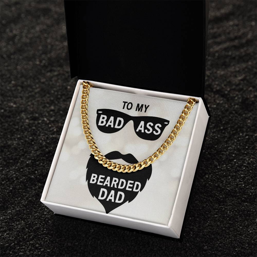 A Dad - badass bearded dad - Cuban Link Chain necklace presented in a box with a message "to my bad ass bearded dad" on the interior lid. The chain is crafted from 14K yellow gold, featuring a Cuban link by ShineOn Fulfillment.