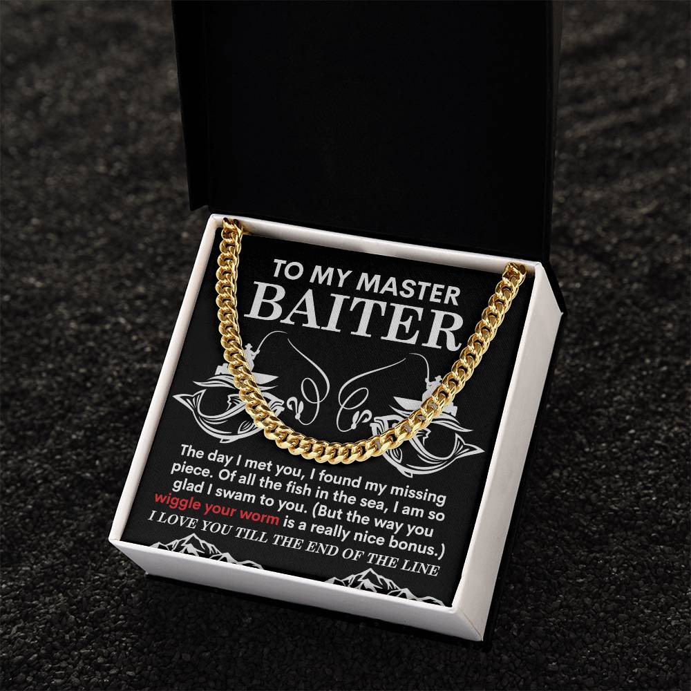 A black box containing a 14K yellow gold Cuban Link Chain necklace titled "My Man-In The Sea," sits atop a card with ocean-themed text and imagery reading "To My Master Baiter.