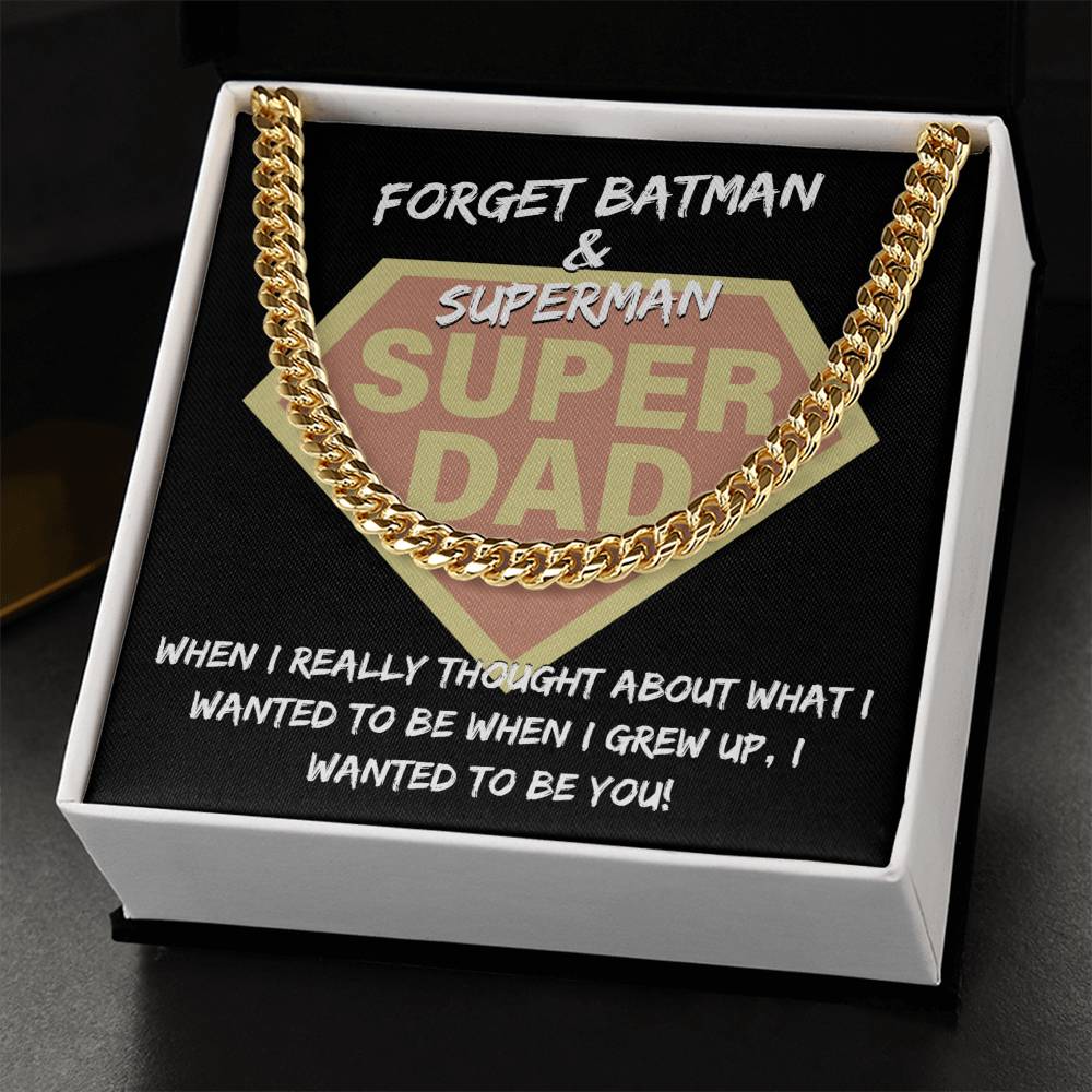 "To Dad, To Be You" emblem resembling a superhero logo, framed by a Cuban link chain, with the text "forget batman & superman, when I really thought about what i wanted to be when I