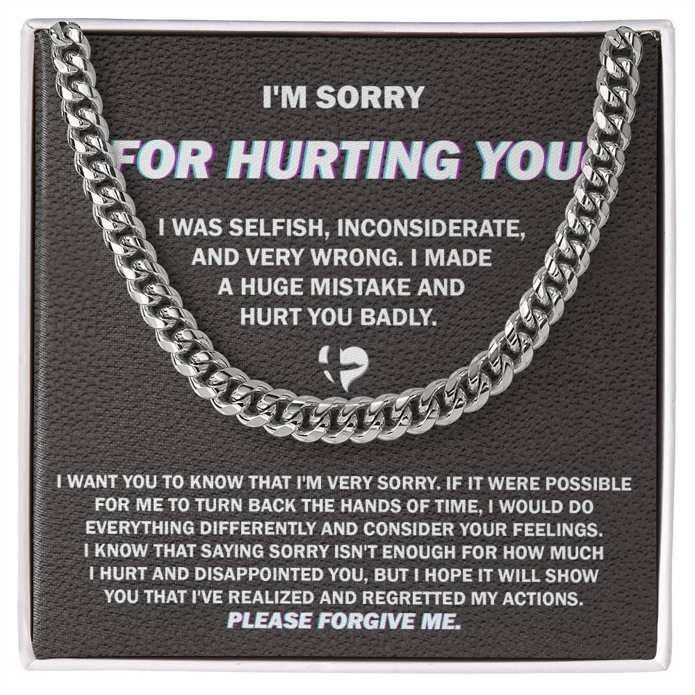 The "Sorry, Hurt You Badly - Cuban Link Chain," crafted in 14K yellow gold, is elegantly presented on a black gift box. The box features an apology message printed in white text, expressing regret for selfish actions, acknowledging wrongdoing, and asking for forgiveness.