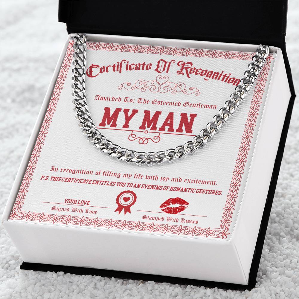 The My Man-Esteemed Gentleman - Cuban Link Chain, crafted from polished stainless steel, rests in an open black box with a certificate labeled "My Man," celebrating romantic gestures between partners.