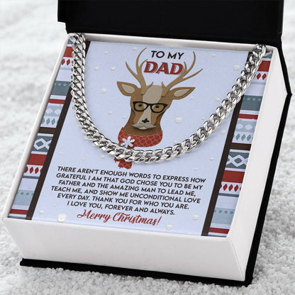 The Dad-Be My Father - Cuban Link Chain necklace comes in an open box with a card showcasing a reindeer design and a heartfelt Christmas message, making it a personalized gift for any occasion.