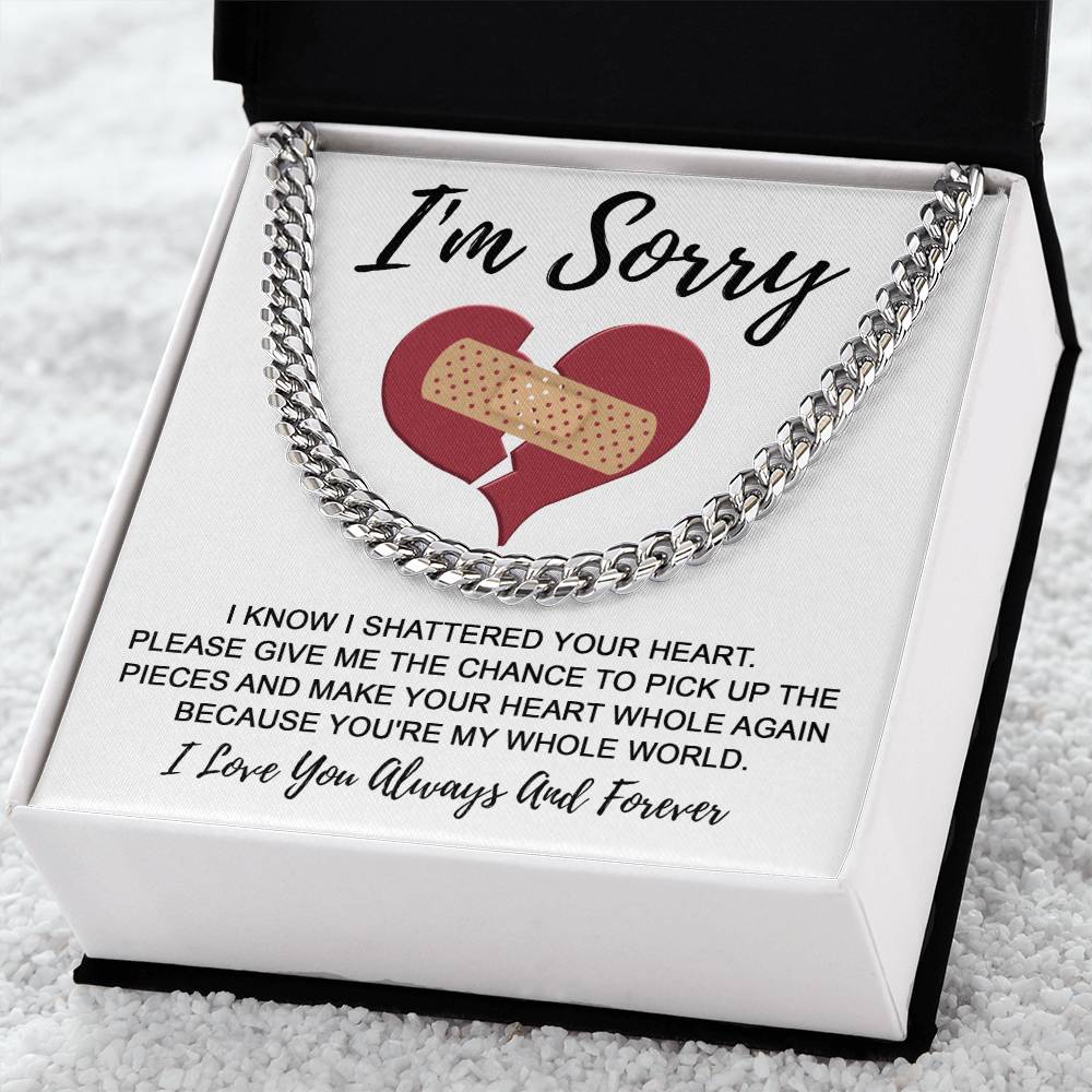 The "Sorry-The Pieces - Cuban Link Chain" is showcased in an open box. The interior of the box includes an apology message adorned with a broken heart graphic and a note that starts with "I'm Sorry.