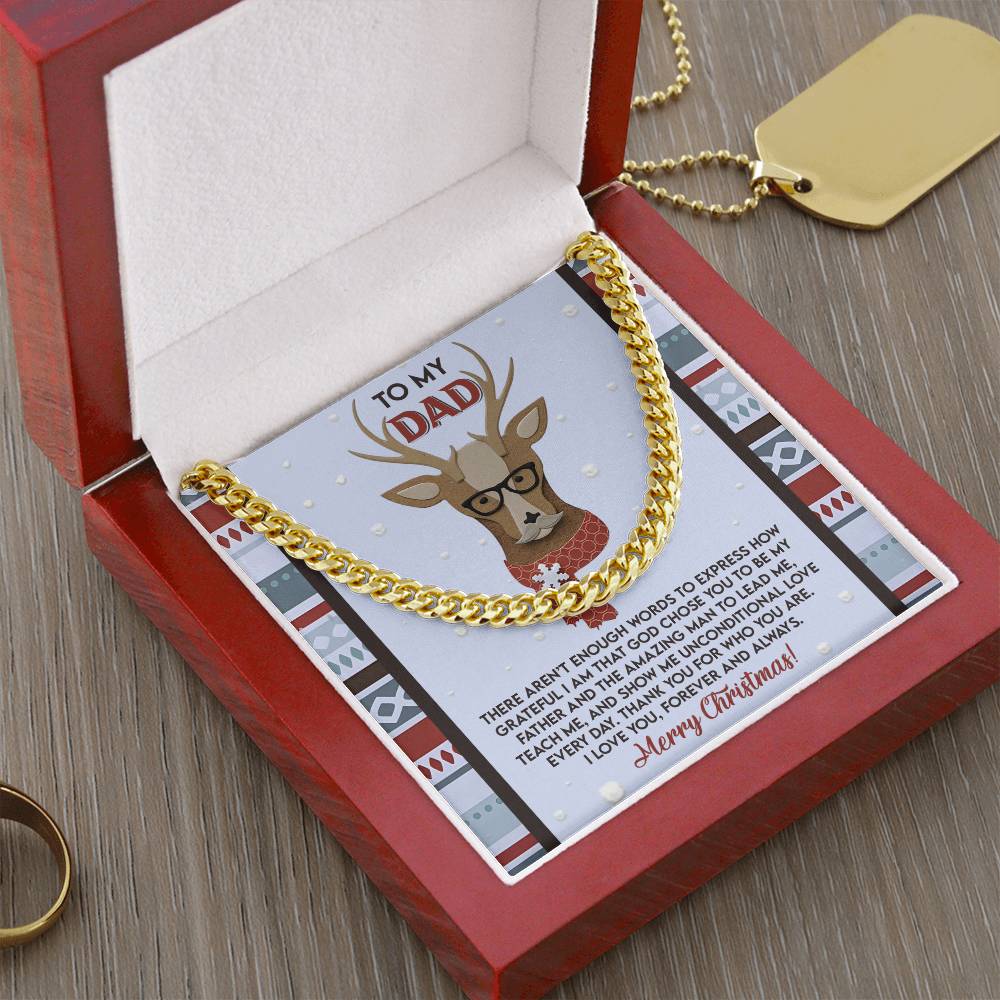 The "Dad-Be My Father - Cuban Link Chain" is beautifully presented in a red box with a card that reads "To My Dad," featuring a reindeer wearing glasses alongside a festive Christmas message. This customized necklace, complete with a gold rectangular tag and ring in the background, makes for an ideal gift for any occasion.