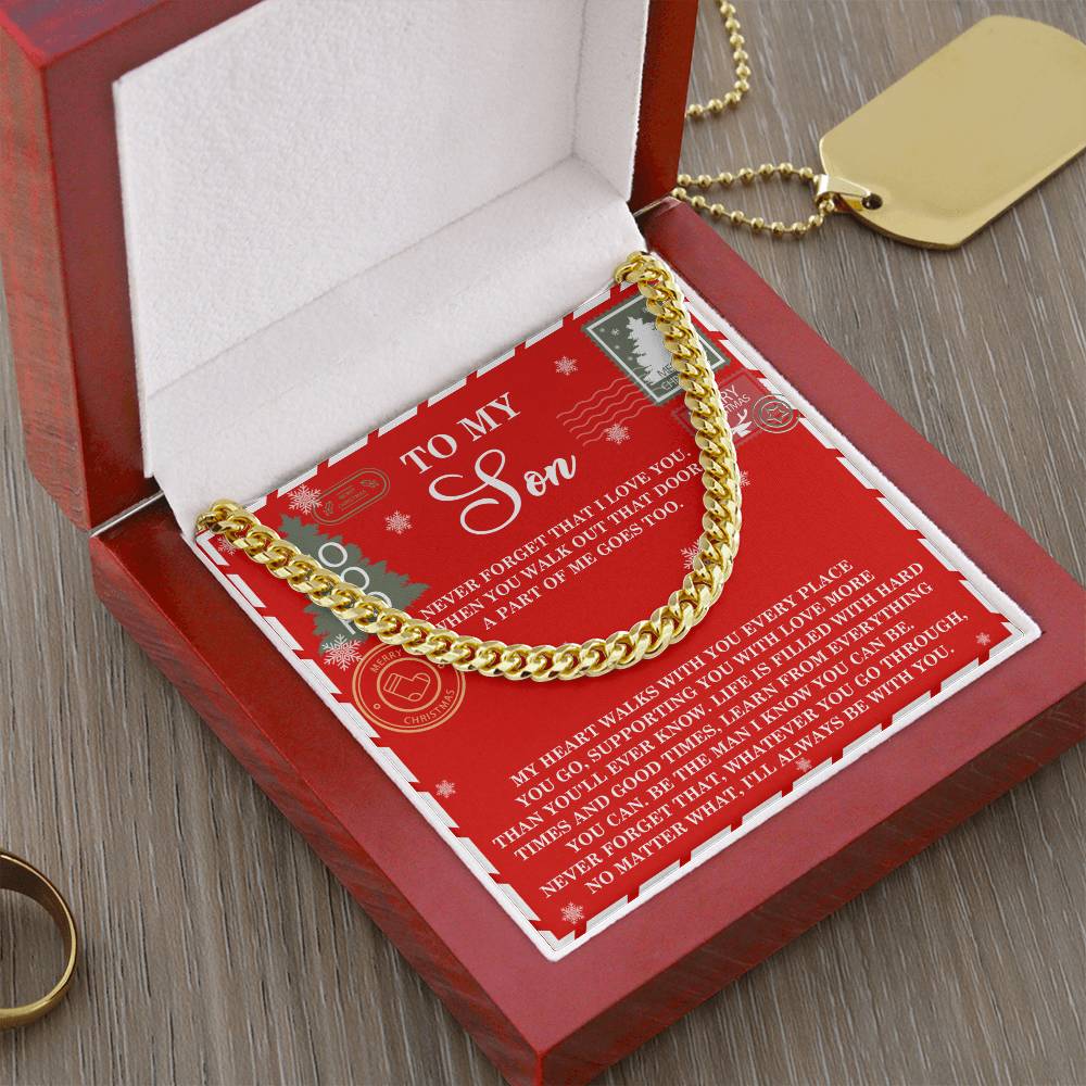 Introducing the Son-That Door - Cuban Link Chain, beautifully presented in a red velvet box. This thoughtful gift for your son includes a heartfelt message card titled "To My Son" and is complemented by a gold dog tag and ring elegantly placed on the wooden surface.