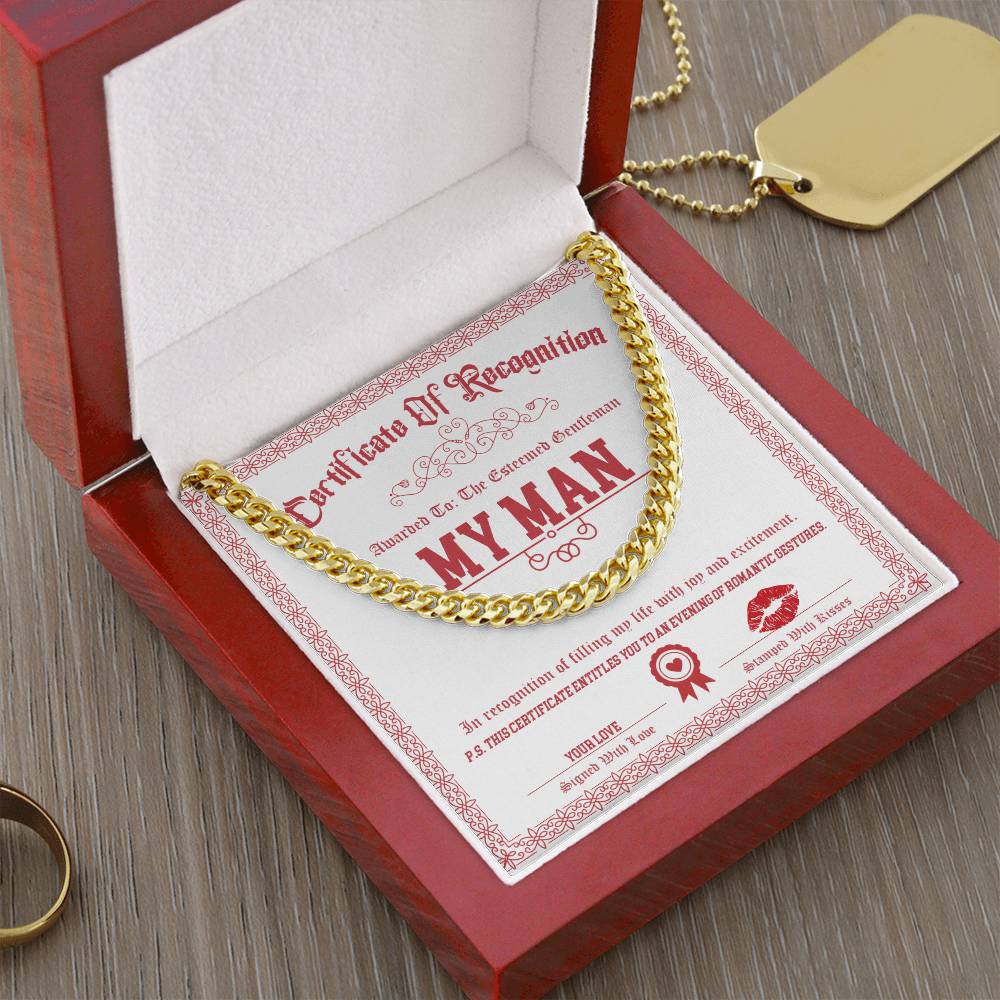 The My Man-Esteemed Gentleman - Cuban Link Chain in shimmering 14K yellow gold gracefully drapes over a witty "Certificate of Recognition" tucked inside a wooden box.