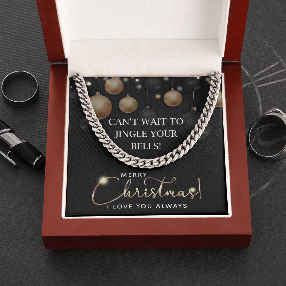 The My Man-Jingle Your Bells - Cuban Link Chain, a polished stainless steel necklace, sparkles in an open red jewelry box. It comes with a holiday message card that says, "Can't wait to jingle your bells! Merry Christmas! I love you always.