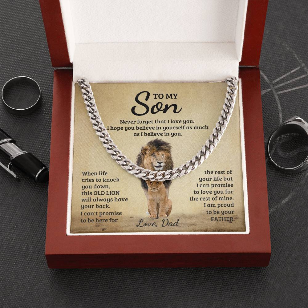 A "To My Son, Never Forget That I Love You - Cuban Link Chain" in a gift box with an inspirational note from father to son featuring a lion motif by ShineOn Fulfillment.