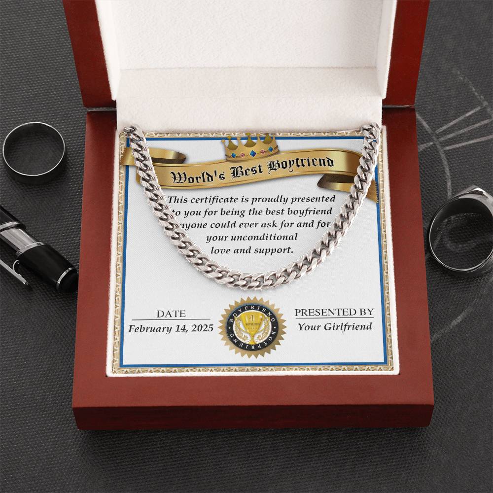 The "Boyfriend-Love And Support - Cuban Link Chain" in 14K yellow gold complements a "World's Best Boyfriend" certificate from "Your Girlfriend," dated February 14, 2025, in a red box. Nearby, rings and a pen enhance the heartfelt setting.