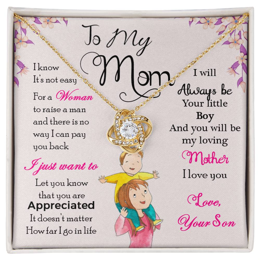 A decorative cushion with a heartfelt message from a son to his mother, accompanied by an illustration of a mother and son, and a "To My Mom, I Will Always Be Your Little Boy" Love Knot Necklace with a gold finish and cubic zirconia pendant from ShineOn Fulfillment.