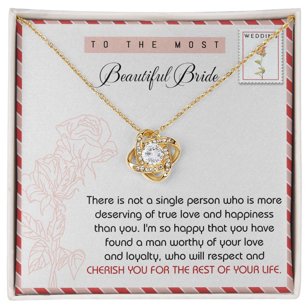 To Bride, Of Your Life - Love Knot Necklace crafted from stunning 14k white gold, featuring a knot-shaped pendant adorned with cubic zirconia crystals. Presented on a card with wedding-themed decor that reads: "To the most beautiful bride" and contains a heartfelt message below.