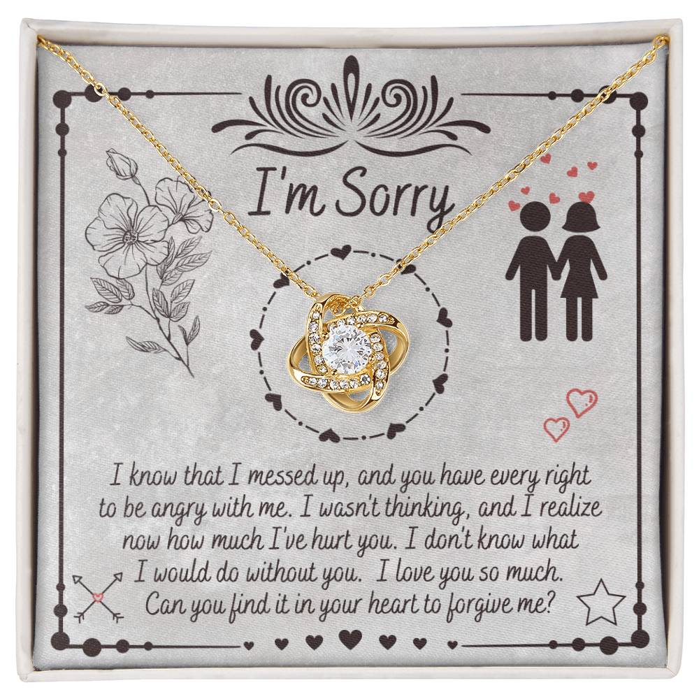 The "Sorry-I Would Do - Love Knot Necklace" is a personalized gift box that includes an apology message and a Love Knot Necklace adorned with cubic zirconia crystals. The box features the phrase "I'm Sorry" above illustrations of flowers and a couple, expressing regret for a mistake and seeking forgiveness.