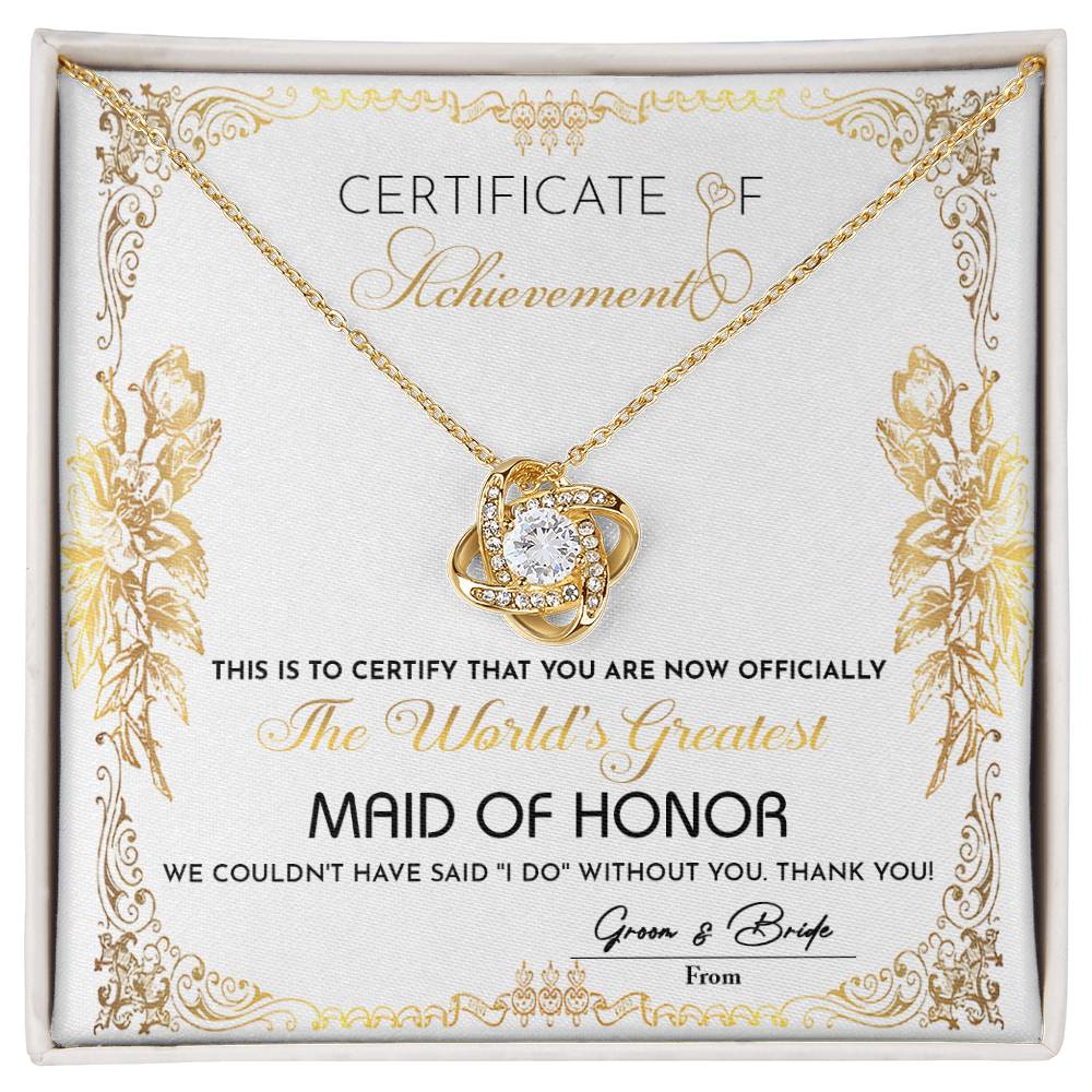 Presenting the "To Maid Of Honor, Certificate Of Achievement - Love Knot Necklace," designed to honor the world's greatest maid of honor. This exquisite necklace, offered in a choice of white gold or yellow gold finish and adorned with shimmering cubic zirconia, represents the heartfelt gratitude of the bride and groom for their invaluable role in the wedding.