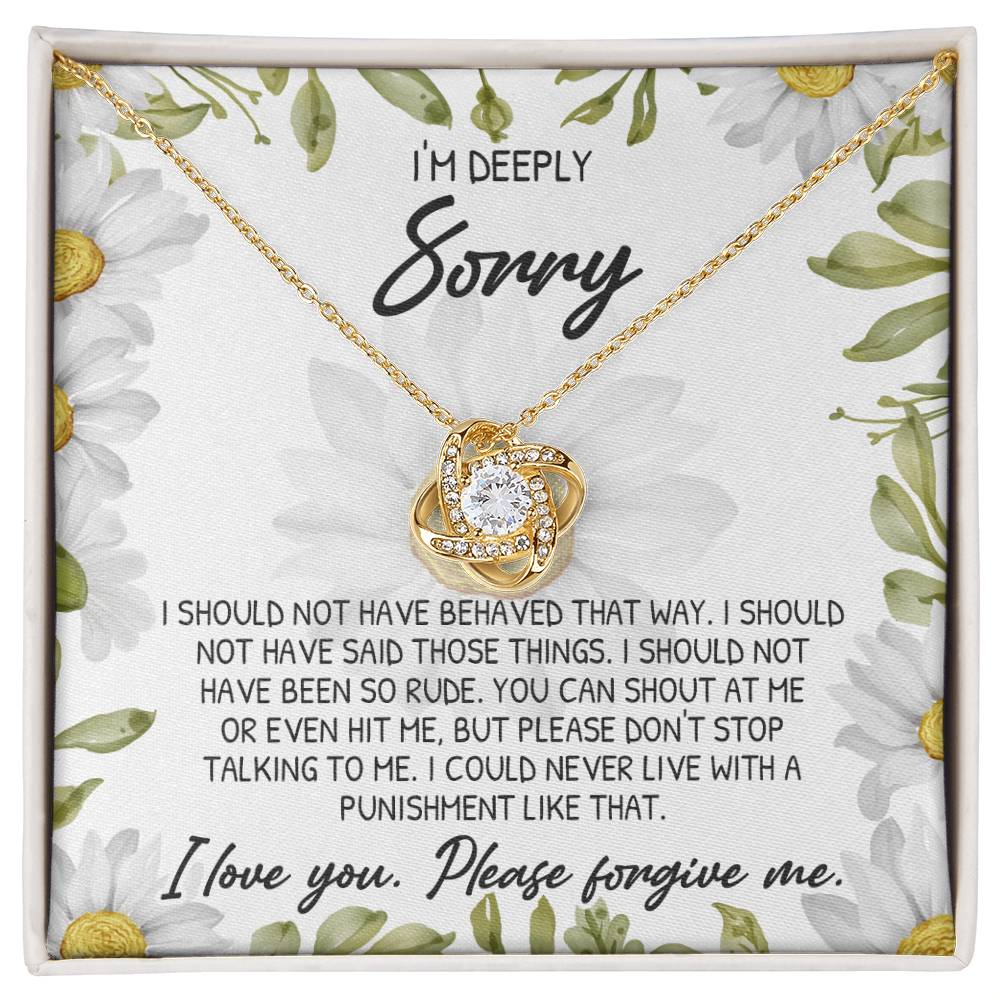 A beautifully designed decorative box featuring a floral pattern, containing the "Sorry-Please Don’t Top" Love Knot Necklace adorned with cubic zirconia crystals. The text reads: "I'm deeply sorry. I should not have behaved that way. I love you. Please forgive me.