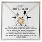 A silver *To Wife-to-be, My Penguin - Love Knot Necklace* with a flower-like pendant is displayed on a jewelry card. The card contains a message to a "Wife-To-Be" featuring a heartfelt dedication and illustrations of two penguins.