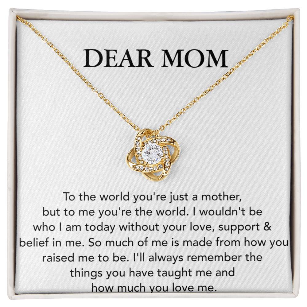 A Dear Mom, To The World You're Just A Mother - Love Knot Necklace by ShineOn Fulfillment, with a heart-shaped pendant adorned with cubic zirconia crystals, displayed on a card with a heartfelt message to a mother, expressing gratitude and love.