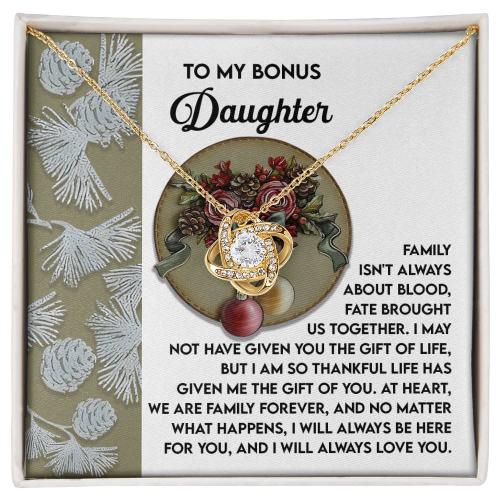 Adorned with a stunning Cubic Zirconia pendant, the Bonus Daughter-Gift Of You - Love Knot Necklace is presented on a decorative card with an inscription that conveys love and gratitude to a bonus daughter.