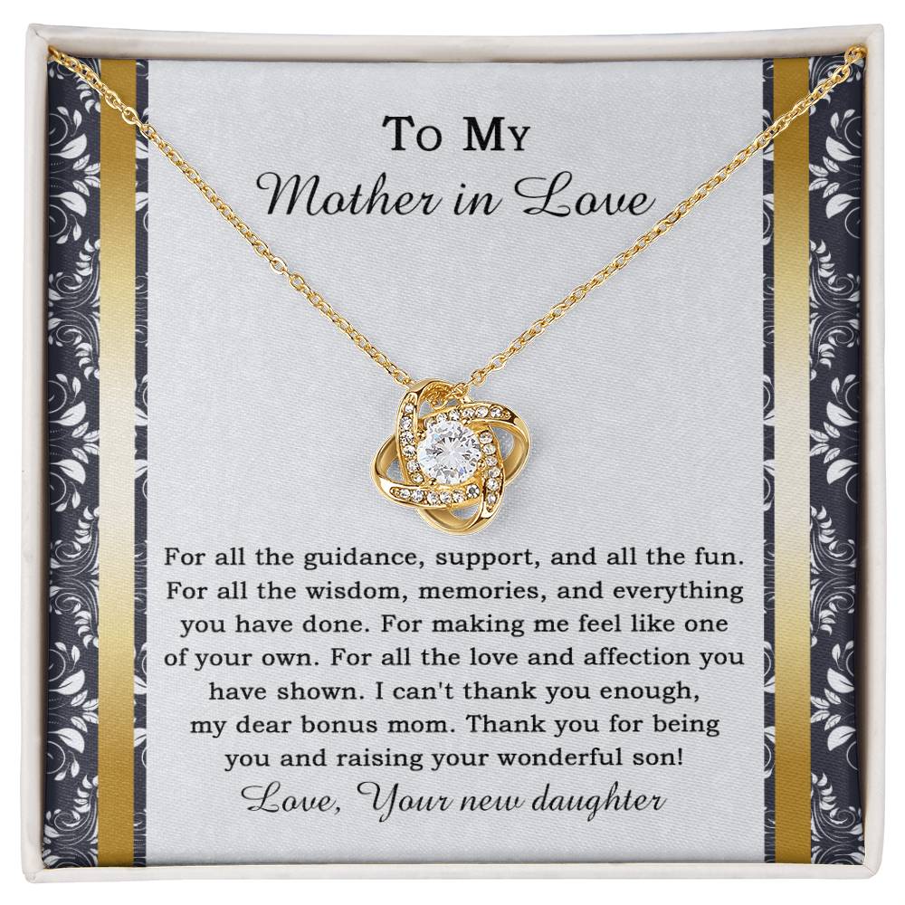 The "To Mother-in-law, Of Your Own - Love Knot Necklace" features a heart-shaped pendant adorned with cubic zirconia crystals, and it comes on a card expressing gratitude for a mother-in-law's love and support.