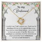 A personalized gift, the *To My Bridesmaid, Standing With Me - Love Knot Necklace* with cubic zirconia crystals, is displayed on a card that expresses gratitude to a bridesmaid, highlighting the importance of her support on the special day.