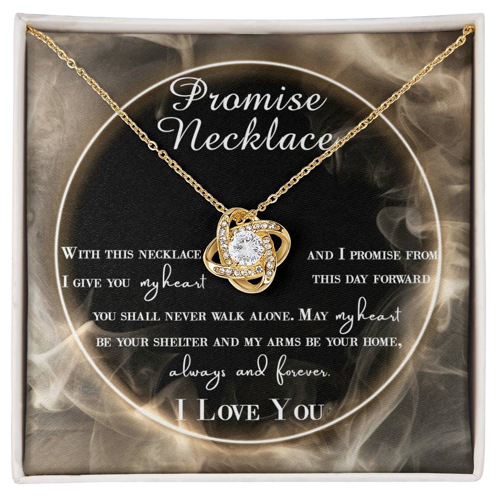 A To Wife, Promise Necklace - Love Knot Necklace with interlocking hearts, adorned with small cubic zirconia crystals and a gold finish, displayed in a box with a romantic message.