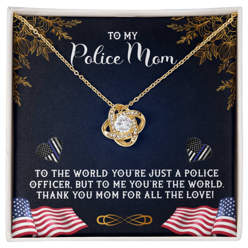 A decorative plaque with a heartfelt message dedicated to a "police mom," featuring a graphic of the To My Police Mom, To The World You're Just A Police Officer - Love Knot Necklace and surrounded by American flag motifs and floral patterns from ShineOn Fulfillment.