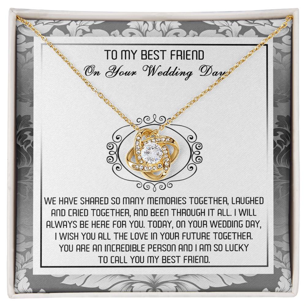 A decorative box containing the "To Best Friend, An Incredible Person - Love Knot Necklace," crafted in 14k white gold with an intricate pendant adorned with cubic zirconia crystals and a heartfelt message titled "To My Best Friend On Your Wedding Day.