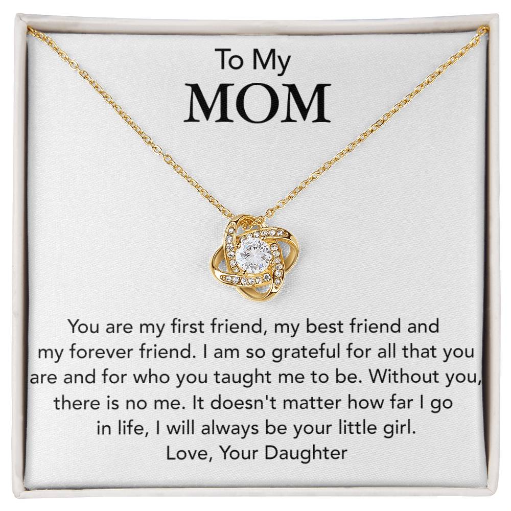 A piece of jewelry with a heart-shaped pendant encrusted with small cubic zirconia crystals, presented in a box with a heartfelt message addressed to 'mom' from a daughter expressing gratitude and eternal love: The ShineOn Fulfillment To My Mom, You Are My First Friend - Love Knot Necklace