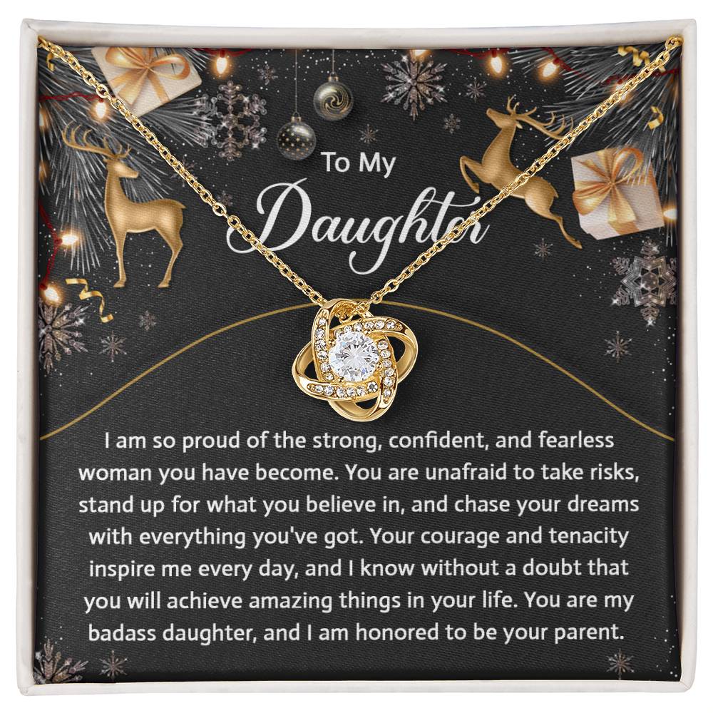 Introducing the Daughter-Amazing Things - Love Knot Necklace, an exquisite gold necklace featuring a circular pendant with a central cubic zirconia crystal. Presented in a gift box, it includes an inspirational message for your daughter, making it the perfect personalized gift she'll cherish forever.