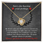 The Sorry-Make Amends - Love Knot Necklace, featuring a heart-shaped pendant adorned with cubic zirconia crystals, is showcased with an apology message stating, "Sorry for hurting your feelings," and a heartfelt note expressing regret and love. This personalized gift eloquently conveys your sincere emotions.