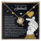 The Soulmate-Look At You - Love Knot Necklace, featuring a white gold finish and cubic zirconia crystals, is beautifully presented in a box with romantic text and hand-heart illustrations, under the title "To My Stunning Soulmate.