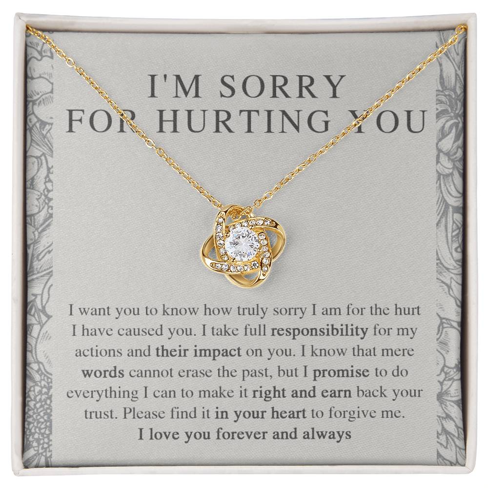 The Sorry-Do Everything - Love Knot Necklace features an eye-catching silver intertwined pendant, elegantly adorned with cubic zirconia crystals, showcased against a heartfelt printed apology message. The message conveys sincere regret, taking responsibility, and earnestly asking for forgiveness with love.