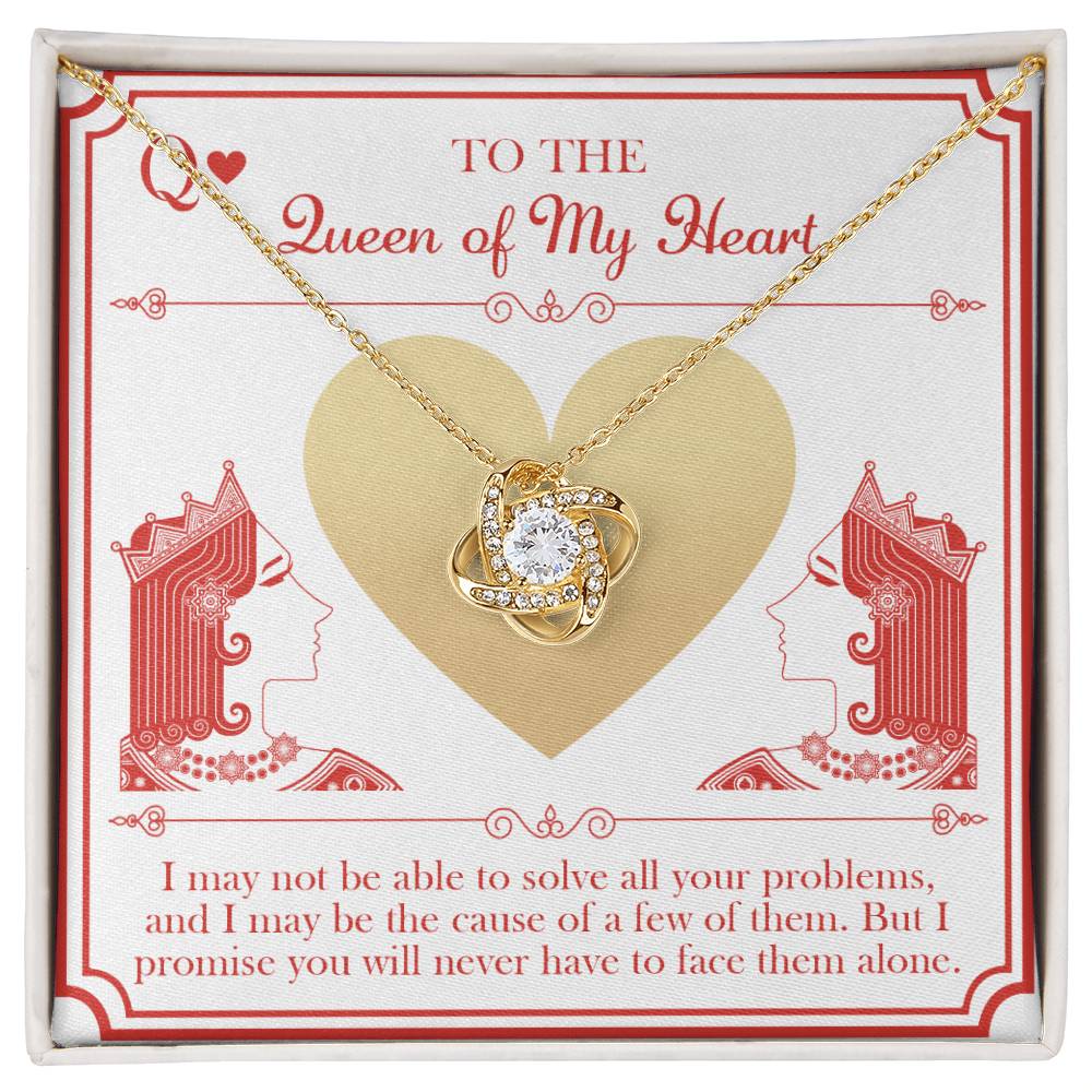 The "To Wife, The Queen - Love Knot Necklace," featuring cubic zirconia crystals, is beautifully presented on a card that displays a heart and two queens. The card bears the words "To the Queen of My Heart" along with a heartfelt message underneath.