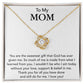 A To My Mom, You Are The Sweetest Gift That God Has Ever Given Me - Love Knot Necklace with a heart-shaped charm, adorned with cubic zirconia crystals, is displayed on a card with a sentimental message dedicated to "mom," expressing gratitude and love for her guidance. (Brand Name: ShineOn Fulfillment)