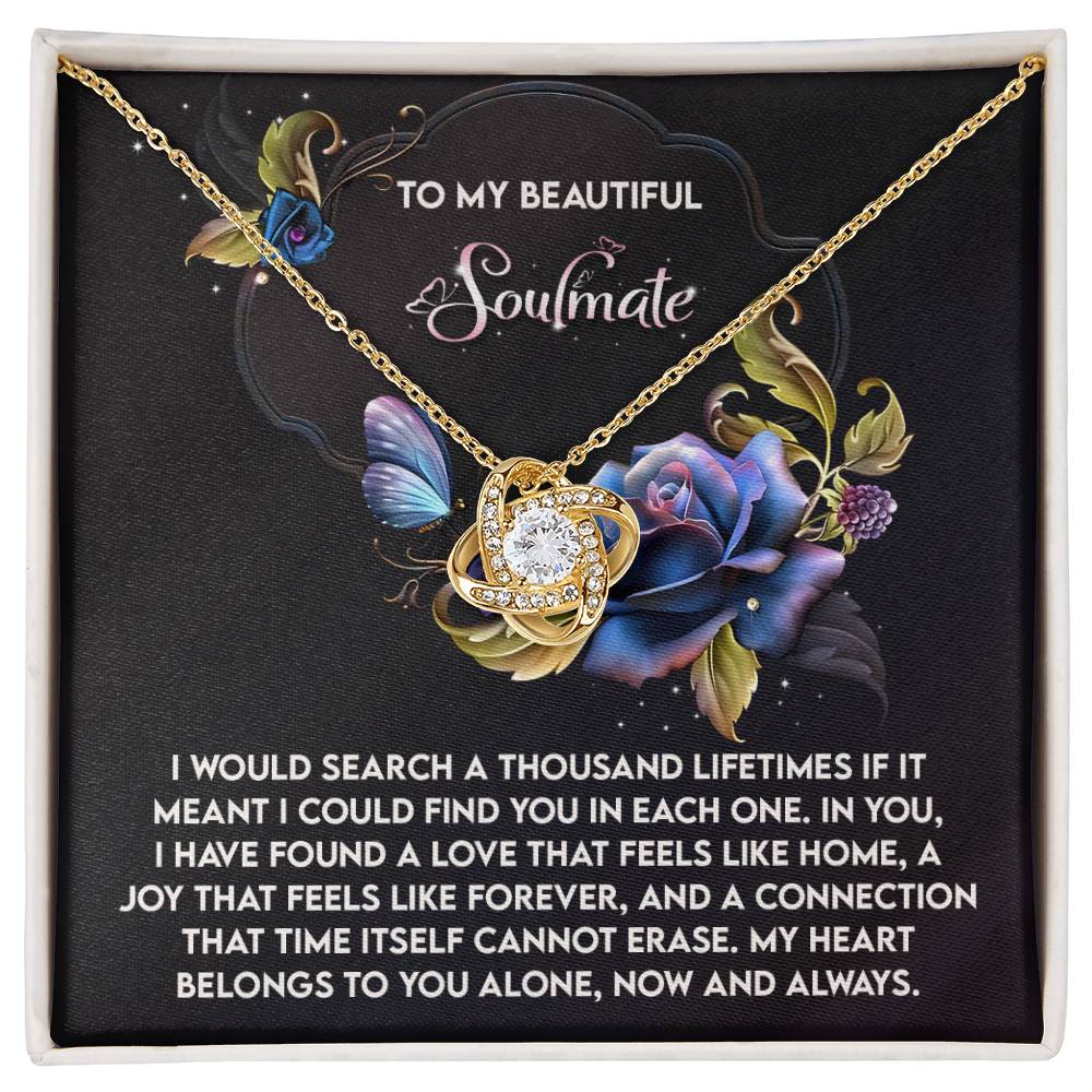 The Soulmate-Like Home - Love Knot Necklace showcases a central gemstone pendant accented with sparkling cubic zirconia crystals. It is elegantly presented in a floral-design box featuring "To My Beautiful Soulmate" and an affectionate message, making it the ideal personalized gift.