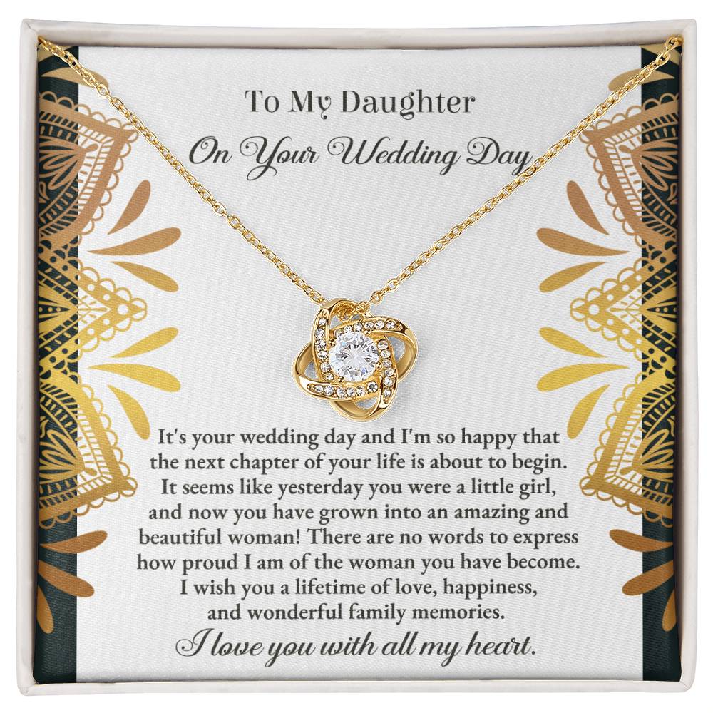 The "To Daughter, Wedding - A Little Girl - Love Knot Necklace" adorned with cubic zirconia crystals is elegantly showcased in a box containing a heartfelt message for a daughter on her wedding day. The text conveys love, pride, and best wishes for a joyful marriage, beautifully accentuated by the option of a white gold or yellow gold finish.