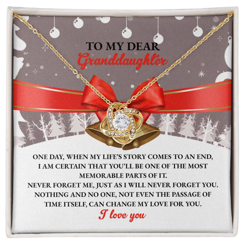 The Granddaughter-Memorable Parts - Love Knot Necklace is a meaningful gift, showcasing a heart and ribbon pendant beautifully presented on a card. The card expresses deep love for a granddaughter, embellished with a red bow and an artistic background. Its sentiment and design shine as brilliantly as cubic zirconia.