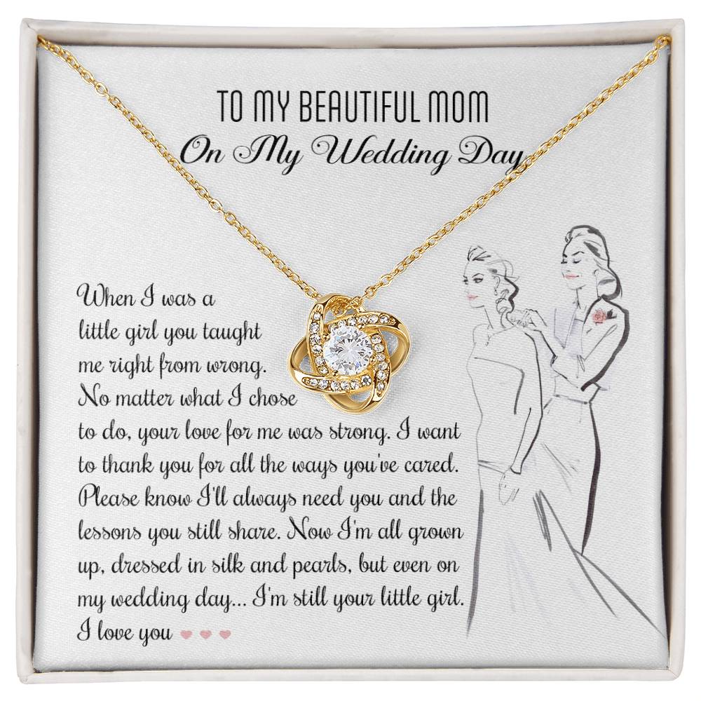 A To Mom, Wedding My Wedding Day - Love Knot Necklace with a card that reads: "To my beautiful mom on my wedding day" with a sentimental message about a daughter's gratitude towards her mother, featuring an illustration of a bride and her mother. The necklace is made of 14k white gold and adorned with cubic zirconia crystals.